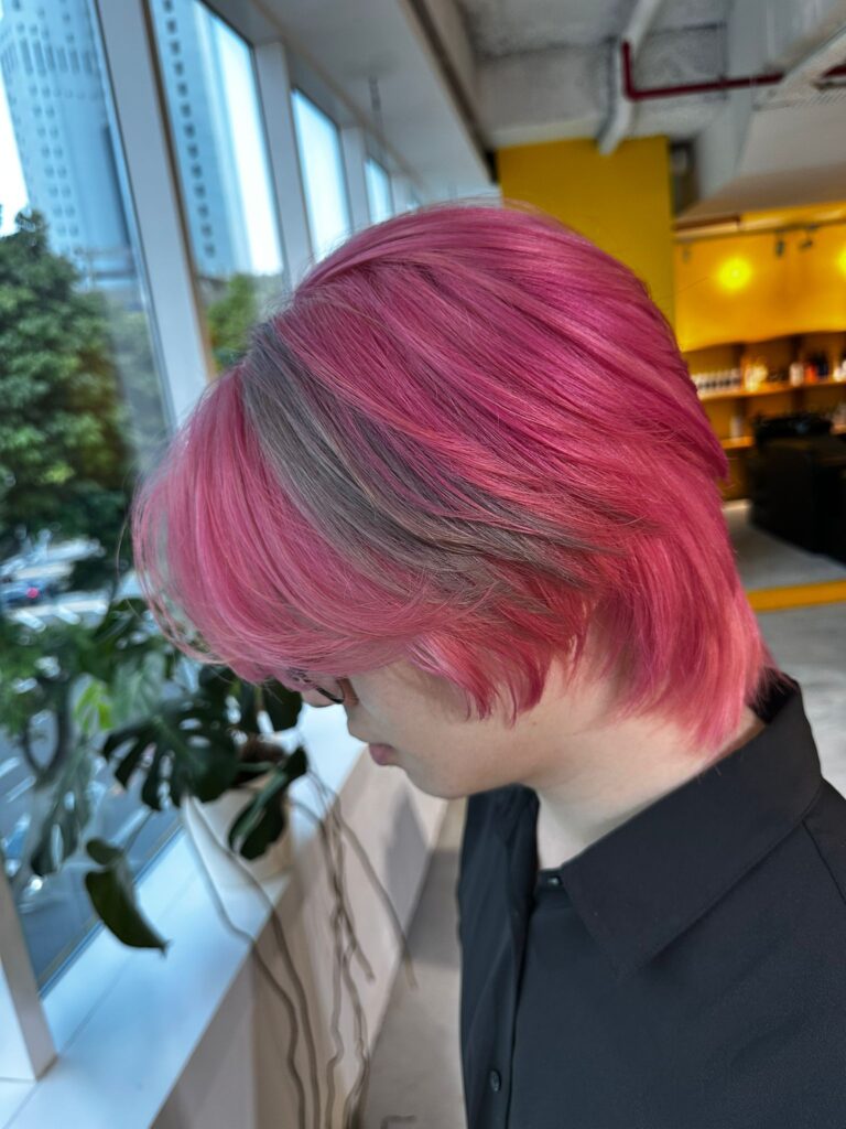 Short layered wolf haircut with pink and beige combination after full bleach at Colors Japanese Hair Salon Singapore, modern Japanese design color