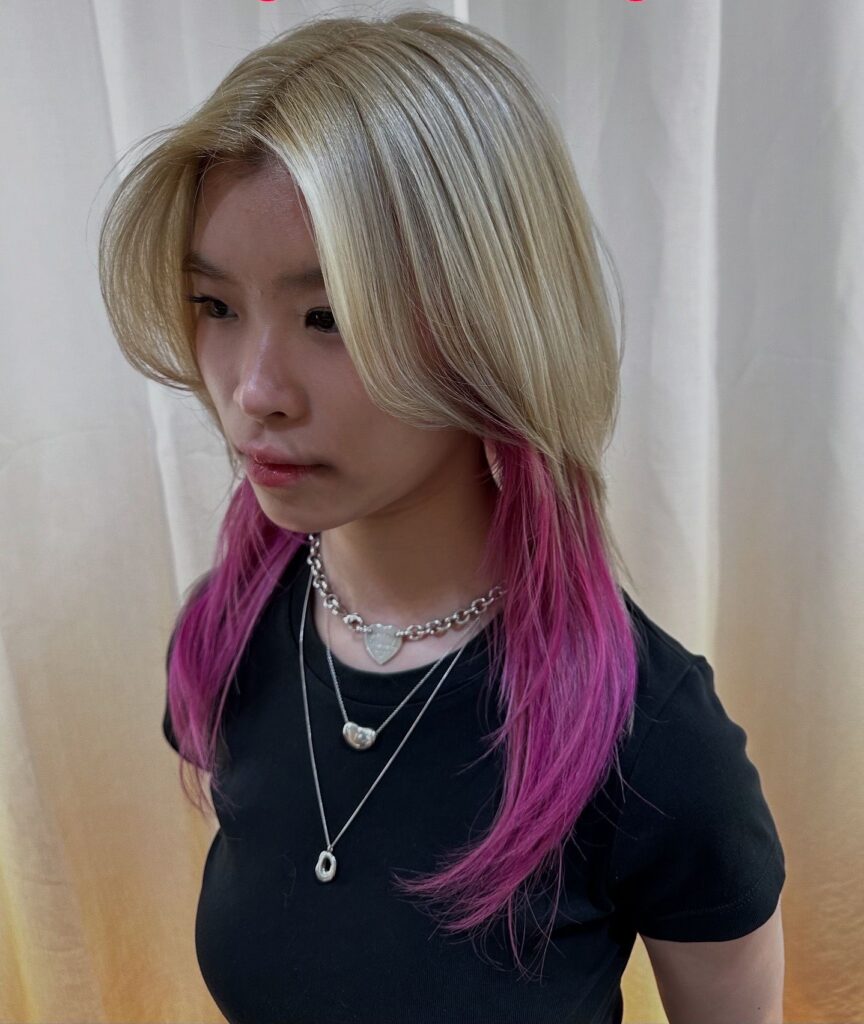 Pink and yellow ash full bleach color at Colors Japanese Hair Salon Singapore, Japanese hair salon near Clarke Quay, low-damage PLEX bleach with medium wolf cut and added volume