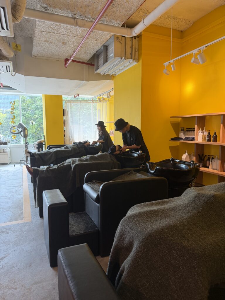 Full-flat shampoo chairs with MARBB microbubble shampoo system at Colors Japanese Hair Salon Singapore, providing relaxing scalp cleansing and improved treatment results near Clarke Quay.
