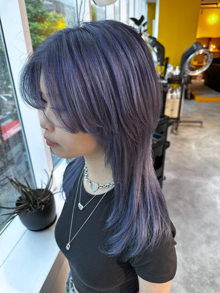 Full bleach dusty purple long layered hair with lip-length bangs at Japanese Hair Salon Singapore near Clarke Quay.