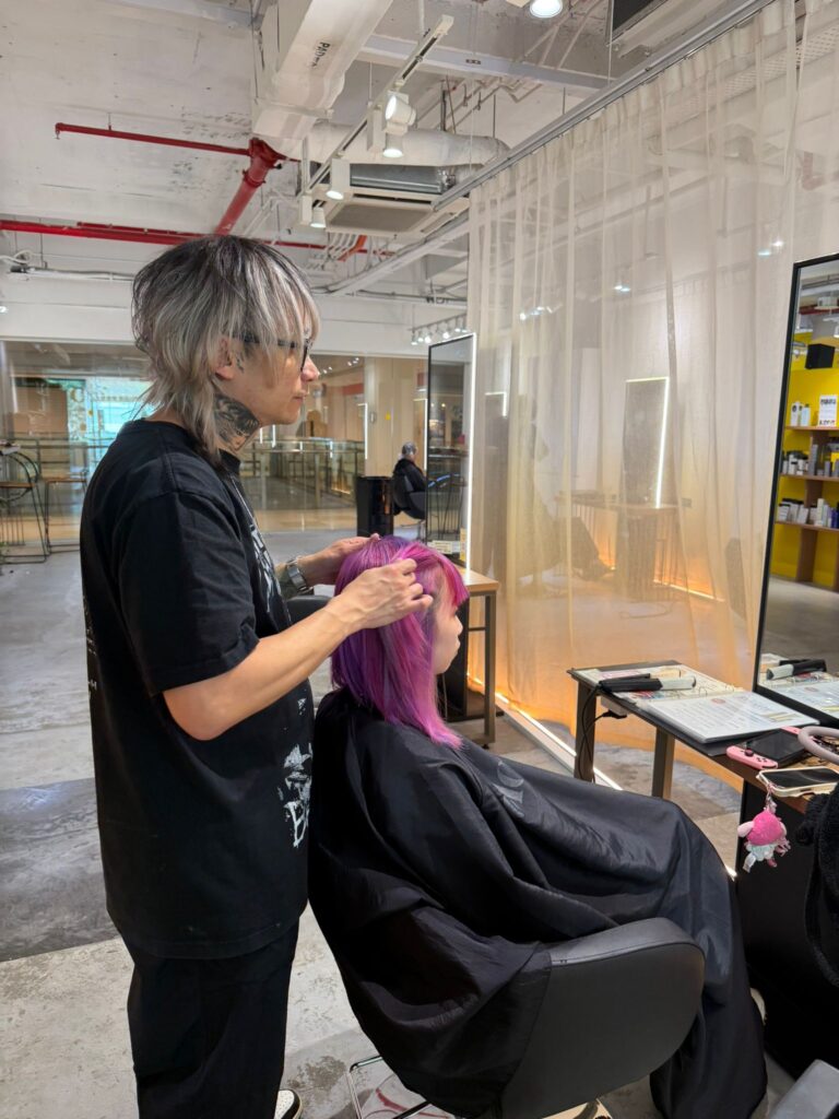 Haircut adjustment after hair color with layered precision cut and color balance by Creative Manager Issey at Colors Japanese Hair Salon Singapore near Clarke Quay Chinatown Singapore