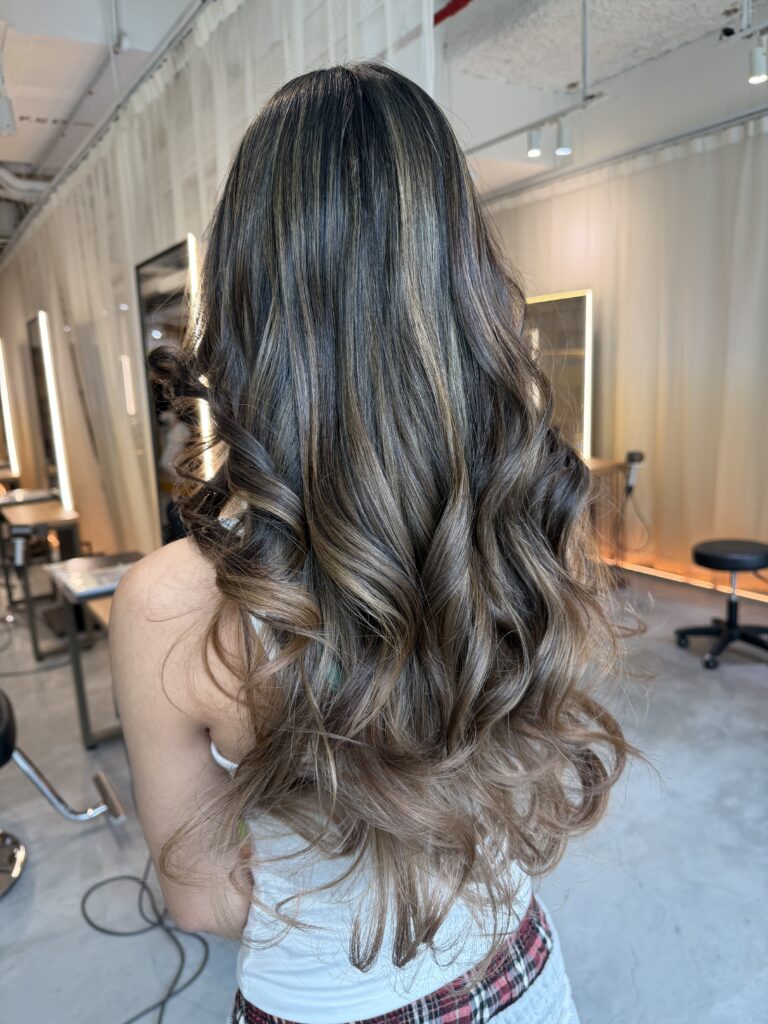 AirTouch blonde gradient hair color in Singapore with low-damage plex bleach, natural root blend, and long layered haircut at a Japanese hair salon.