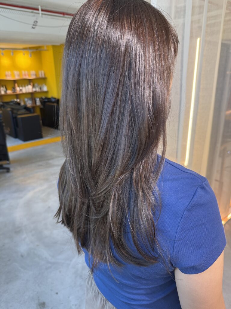Dark Ash Long Layer Singapore | Japanese Hair Salon Singapore 1 Dark ash brown long layered hairstyle with glossy low-damage color by Stylist Satsuki and Colorist Ura at Colors Japanese Hair Salon Singapore.