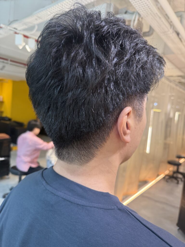 Men’s short fade haircut with dark cool brown grey coverage at Japanese Hair Salon Singapore. Ammonia-free hair color and textured perm for natural business styling.