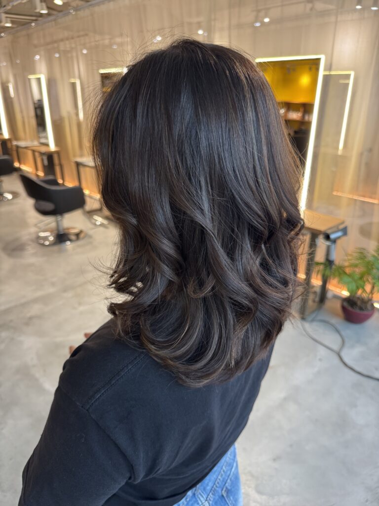 Natural grey blending highlights with blue ash tone on a medium layered hairstyle, created with Plex for low-damage lightening and finished with scalp cleansing bubble care at a Japanese hair salon in Singapore.