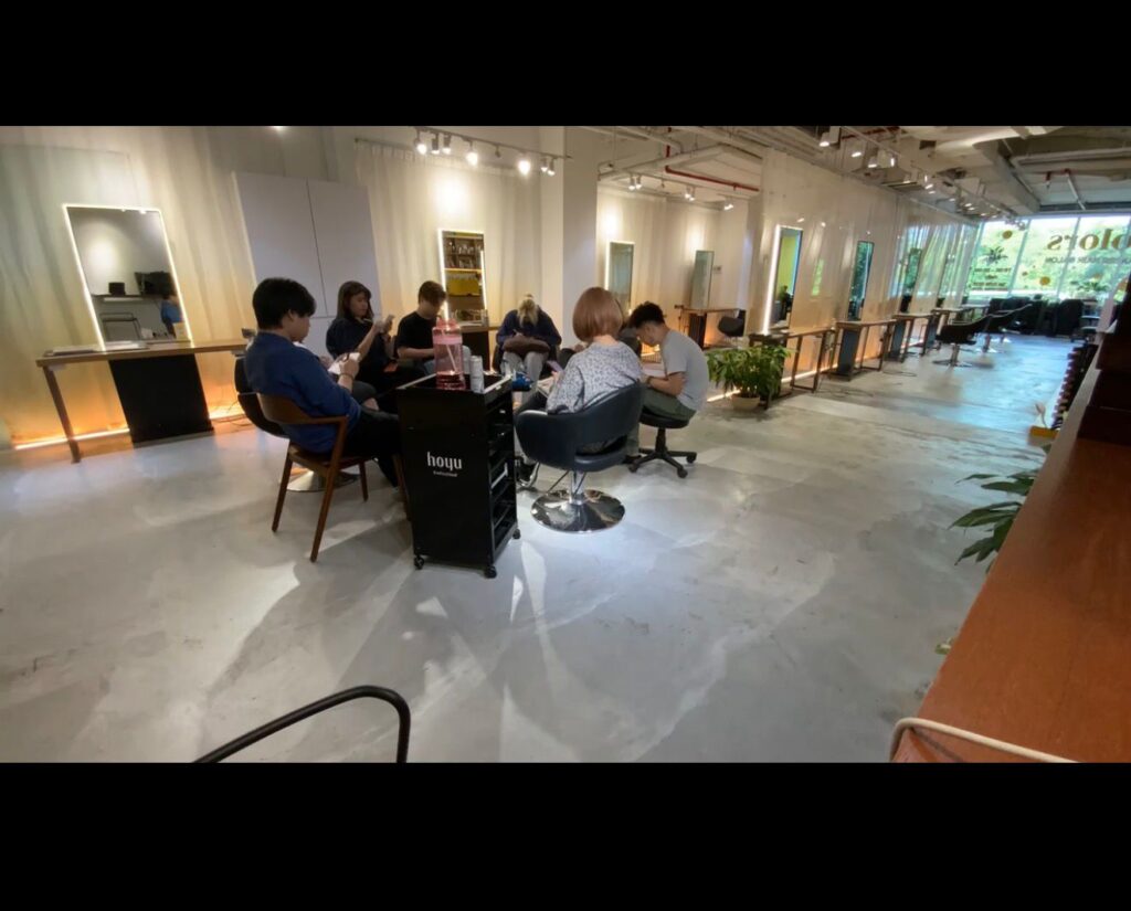 Colors Japanese Hair Salon Singapore team meeting focused on stylist education, service improvement, latest hair trends, treatments, color, and perm techniques.
