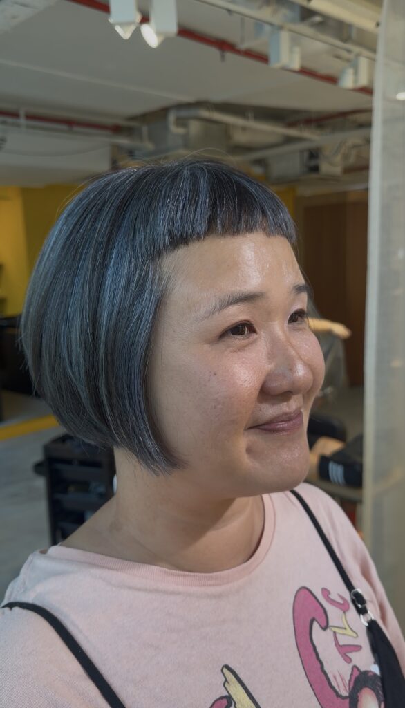 Short grey blending highlights on natural hair with bleach highlights and silver grey toner for a low-maintenance grey hair blending look in Singapore