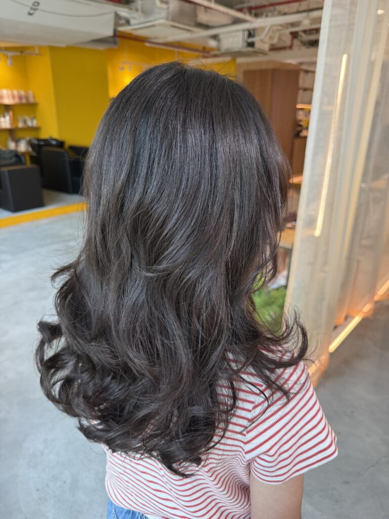 Long Digital Perm with Layered Cut for Straight Virgin Hair in Singapore 1 Long straight virgin hair transformed with a digital perm and layered cut, creating soft curls and movement with Plex-supported care in Singapore