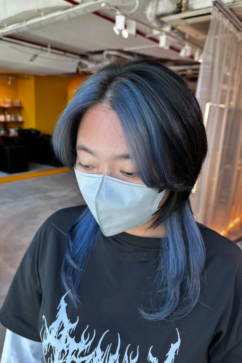 Medium Layer Wolf Cut with Blue Face-Framing Bleach Design at Japanese Hair Salon Singapore. Plex bleach, dark ash base color, blue highlights around the face and nape.
