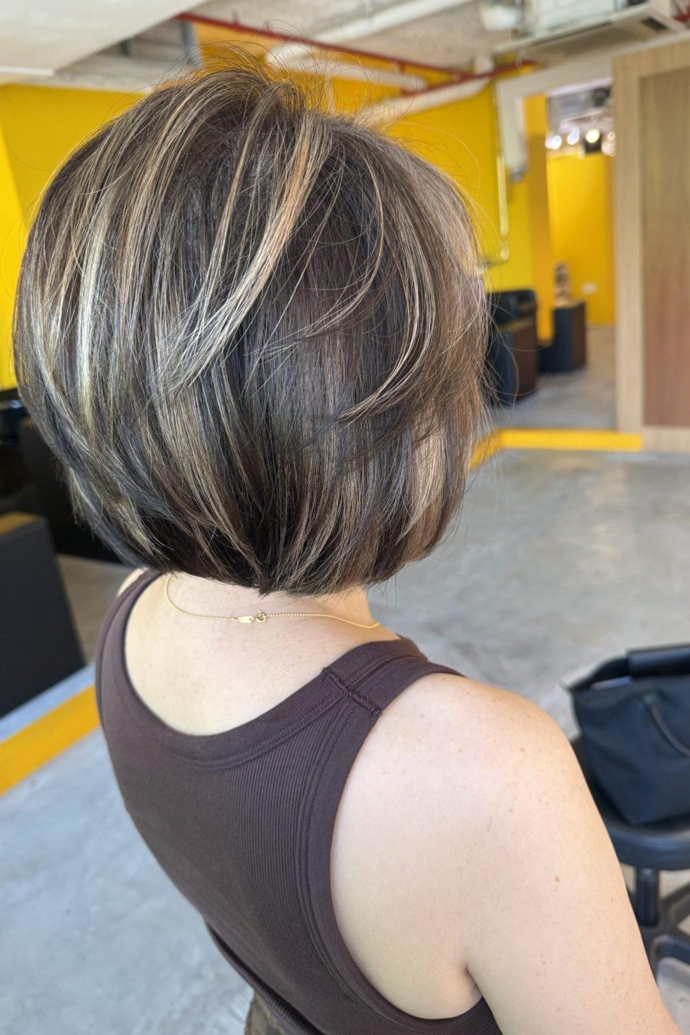 Grey blending highlights bob with soft natural grey coverage and low-damage plex bleach by Stylist Satsuki and Colorist Ura at Colors Japanese Hair Salon Singapore.