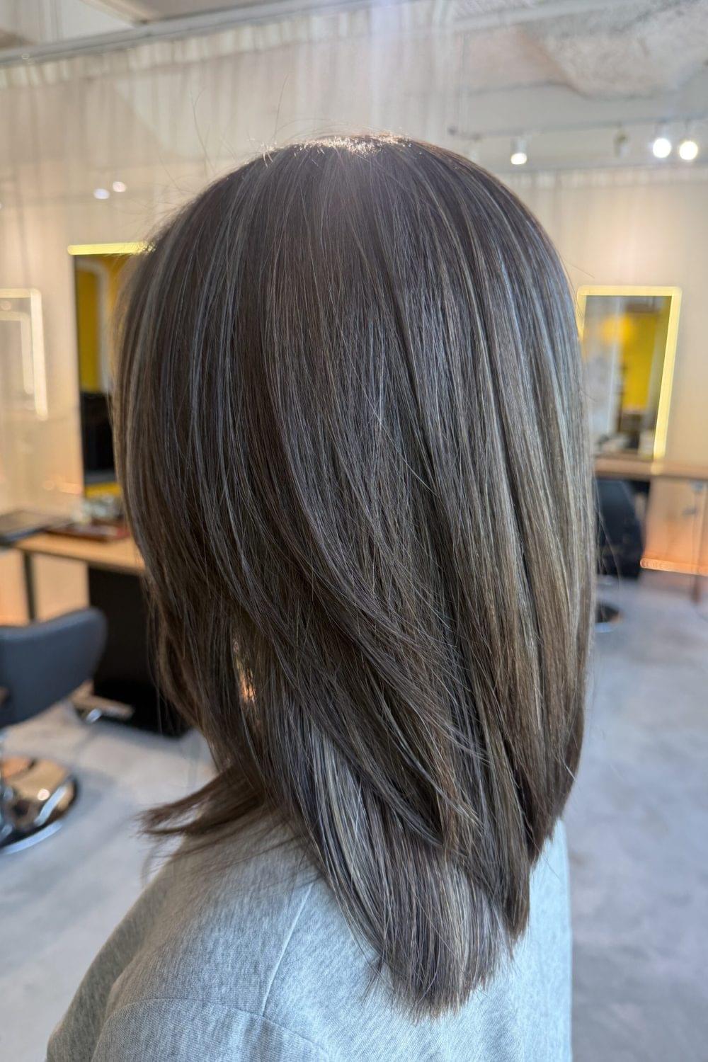 Grey blending medium layered hair with soft ash tones and natural grey coverage by Stylist Sylvia and Colorist Ura at Colors Japanese Hair Salon Singapore.