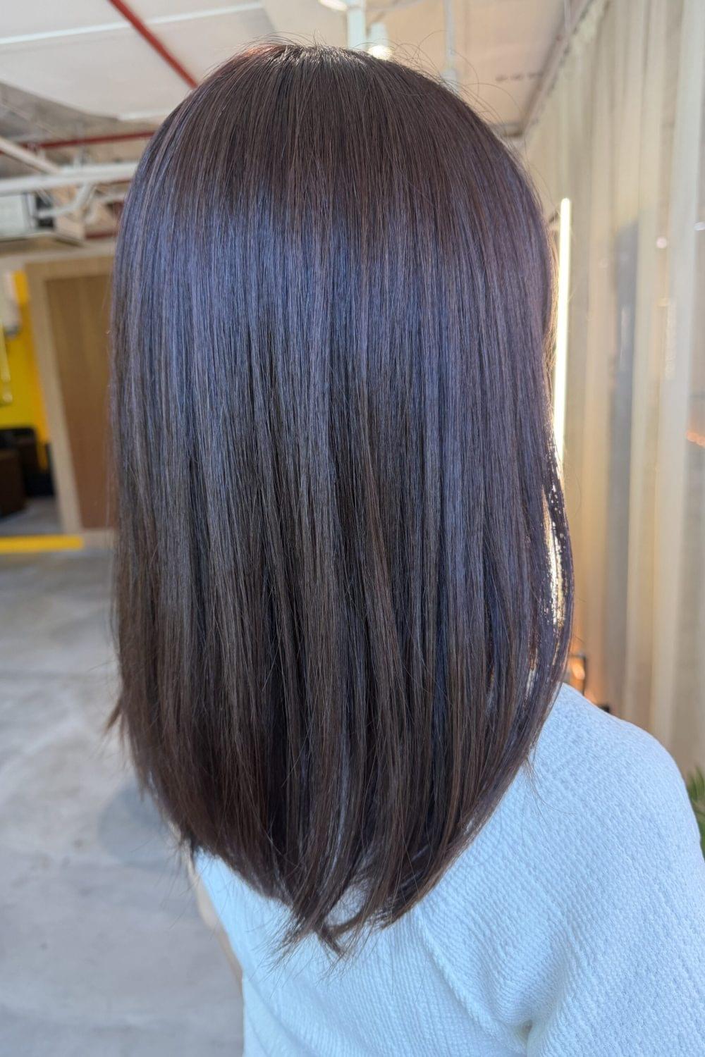 Plum brown grey coverage hair with soft shine and natural one-tone color by Stylist Satsuki and Colorist Ura at Colors Japanese Hair Salon Singapore.