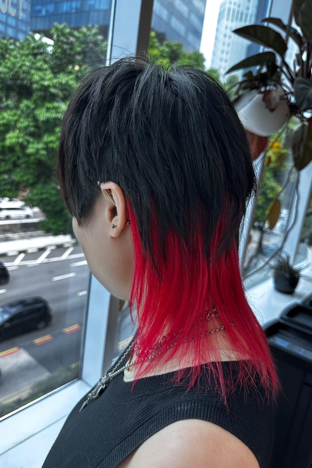 Medium Layer Wolf Cut with Red Inner Bleach Color at Japanese Hair Salon Singapore. Low-damage Plex bleach, red inner color, face-framing wolf haircut.
