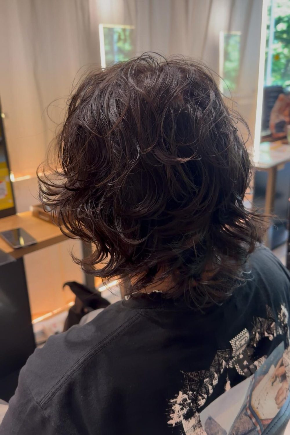 Japanese messy layered perm for medium hair with natural volume and texture at a Japanese Hair Salon Singapore. Easy styling using mousse or wax with a long-lasting soft perm.