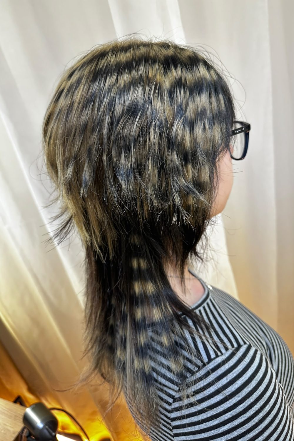 High layer Jellyfish Cut with creative bleach design color. Removable black color is applied after bleaching to create bold contrast while allowing future color changes. Styled at Colors Japanese Hair Salon Singapore.
