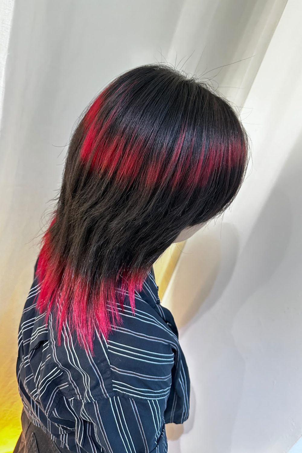Medium Wolf Cut with Red Ring Color Bleach Design at Japanese Hair Salon Singapore. Low-damage Plex bleach, vivid red fashion color, layered wolf haircut.