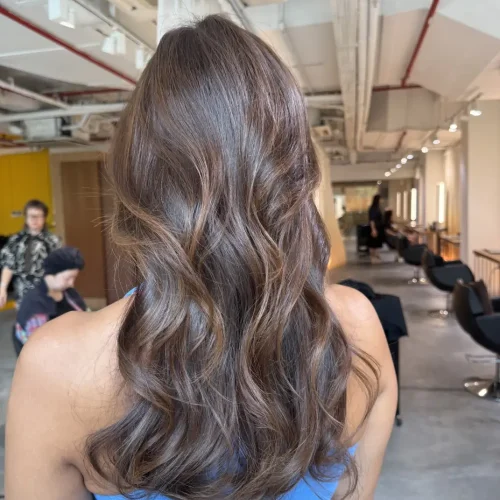 Singapore Honey Brown Hair on long layered hair with soft surface layers, glossy Plex Color, and natural movement by Stylist Faye and Japanese Colorist Ura.