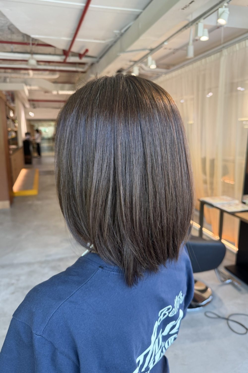 Medium bob with dark ash brown grey coverage color at a Japanese Hair Salon Singapore. Bright grey coverage using Plex Color, paired with a neat medium bob, scalp cleansing spa, and optional keratin treatment for smoother, healthier hair.