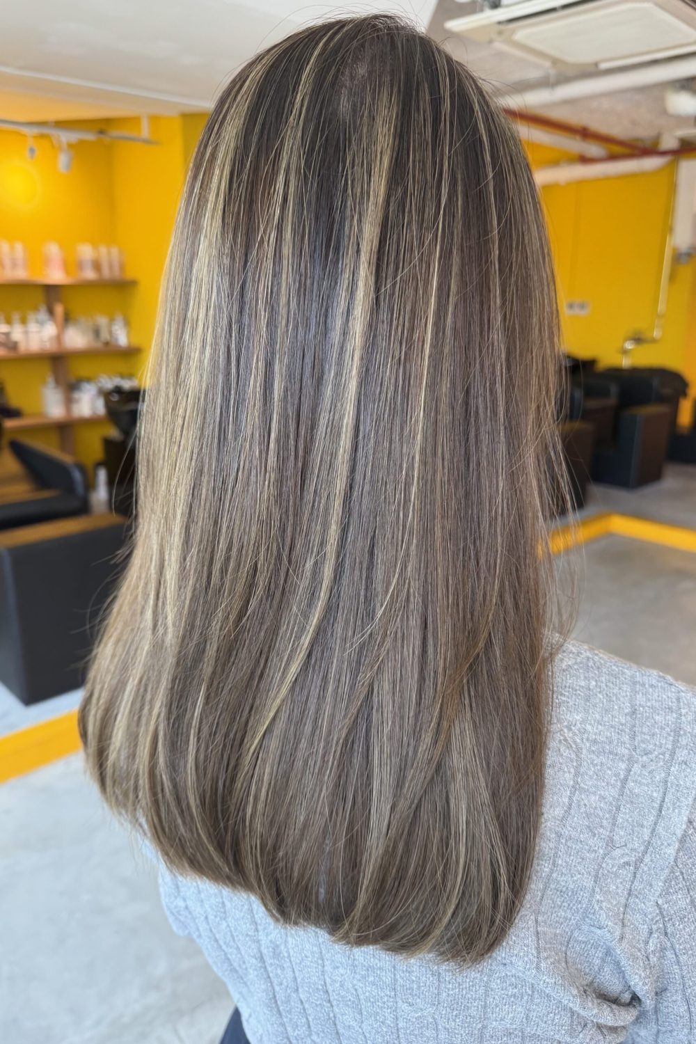 Long grey blending highlights with a silver beige tone, soft surface layers and low-damage Plex lightening at a Japanese hair salon in Singapore.