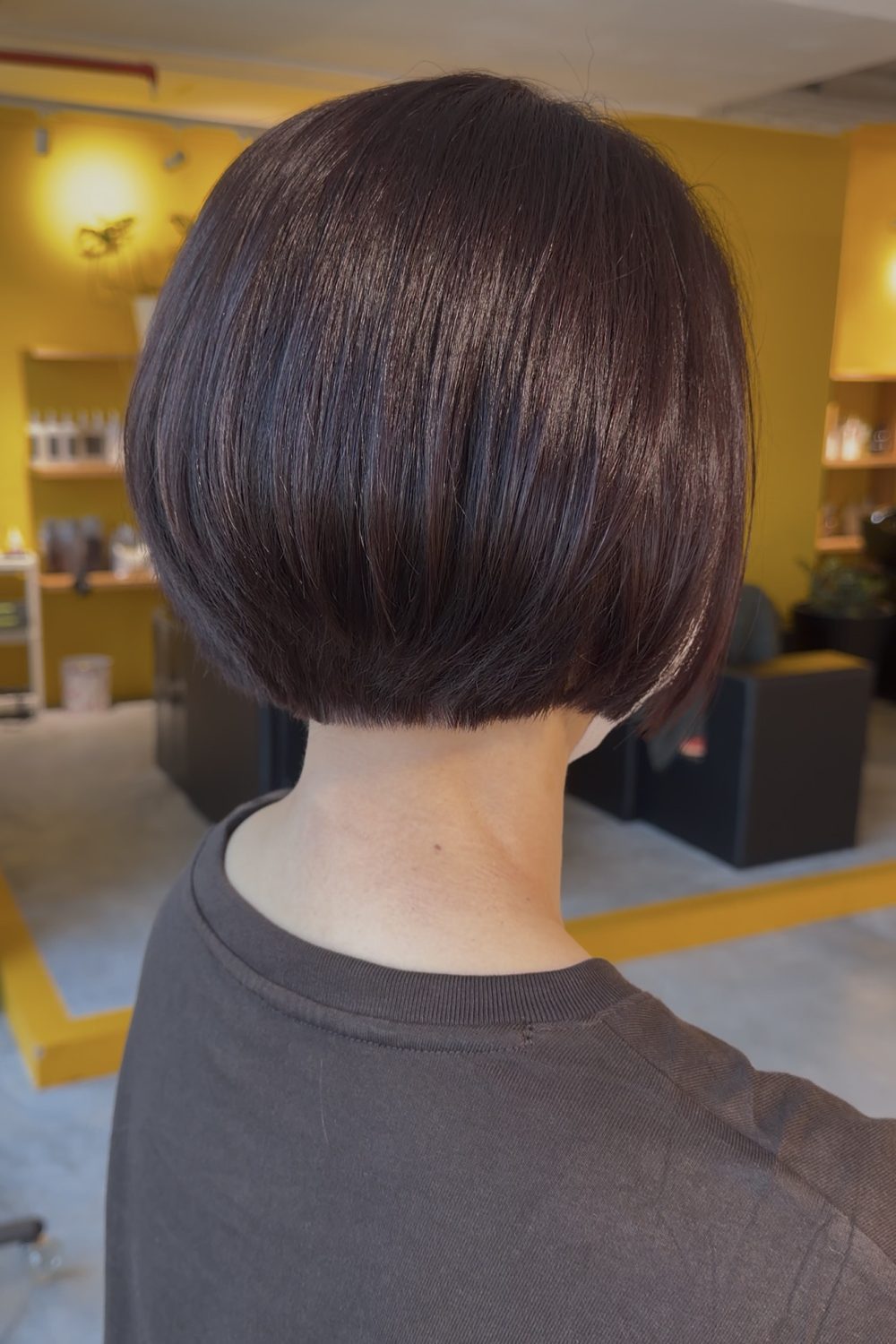 Short graduation bob with plum brown grey coverage and glossy finish in Singapore