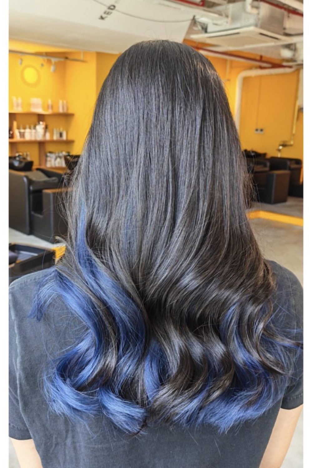 Dark blue inner color on natural hair with Plex bleach for low-damage color in Singapore
