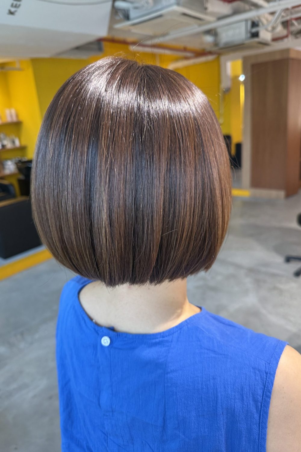 A bright level 8 grey coverage bob with Plex Color at a Japanese Hair Salon Singapore, maintaining natural brightness while covering grey hair with a soft, healthy finish.