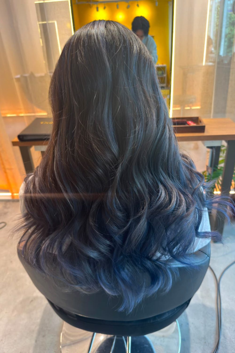Long bleach AirTouch color with a dark blue to light blue gradient, soft surface layers, and Plex-supported low-damage lightening in Singapore