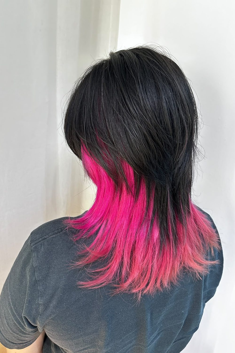 Medium Wolf Cut with vibrant light pink inner bleach color at Japanese Hair Salon Singapore. Low-damage Plex bleach, hidden inner color, and easy-maintenance Japanese hairstyle.